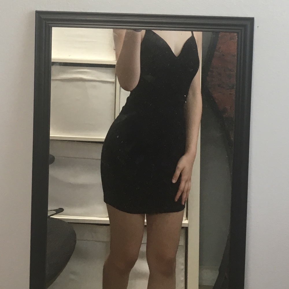 Firm fitting tight black dress